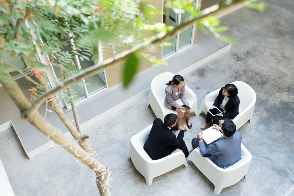 K&W Marketing Consultants | Top view of business people discussion
