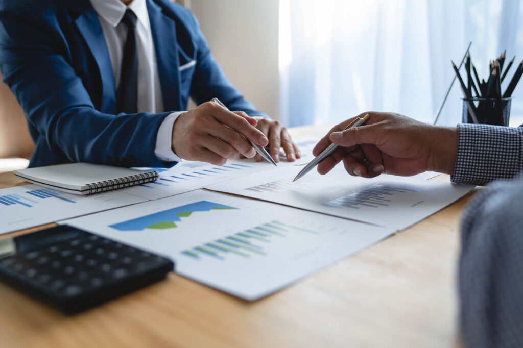 K&W Marketing Consultants | Young Asian businessman analyzing and discussing and brainstorming