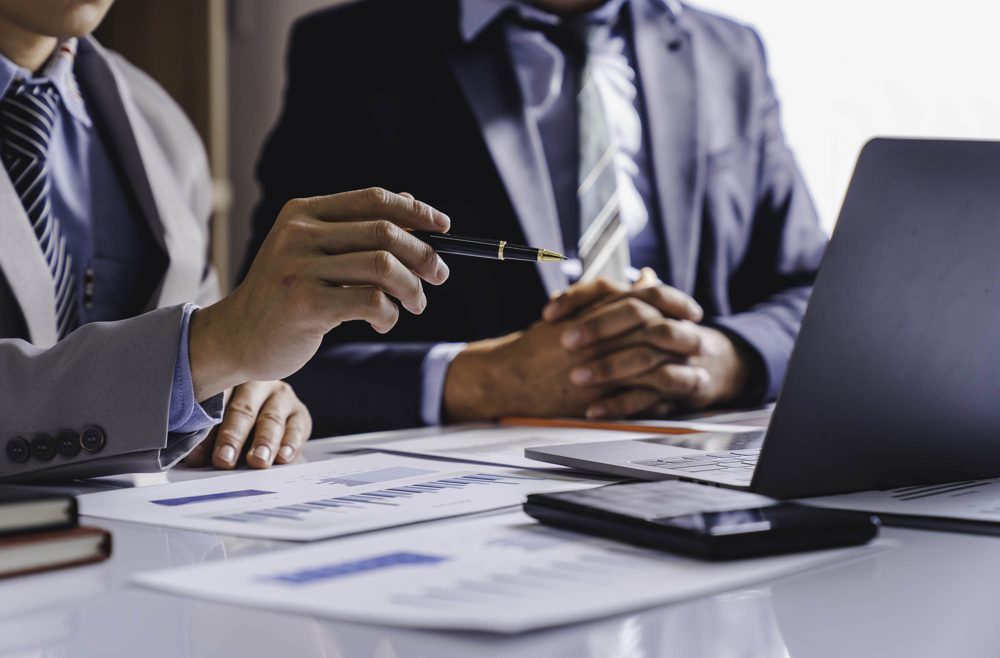 K&W Marketing Consultants | Business people meeting to analyze and discuss and brainstorm data, charts, reports showing investment results and financial profits in the office. financial advisor Teamwork and Accounting Concepts