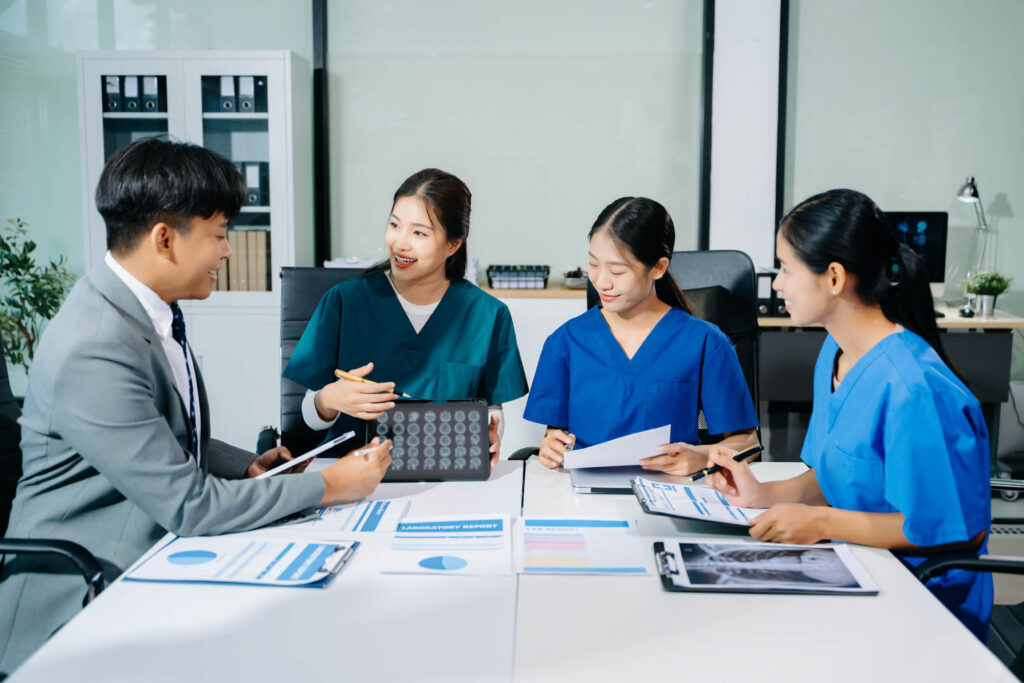 K&W Marketing Consultants | Doctors, nurses, and consultant review anatomy data on tablet an
